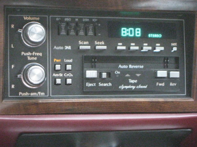 1989 Silver over Grey Metallic Cadillac DeVille 4 Door