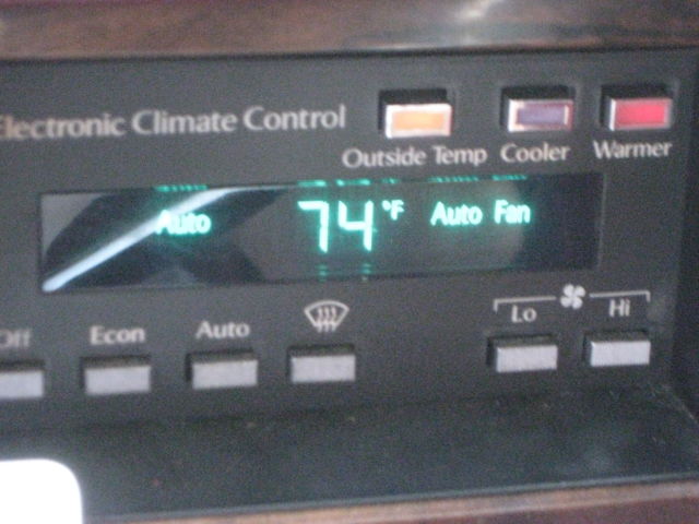 1989 Silver over Grey Metallic Cadillac DeVille 4 Door