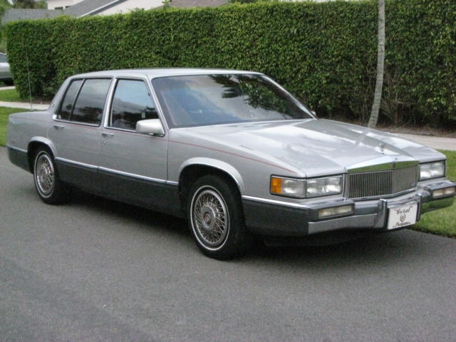 1989 Silver over Grey Metallic Cadillac DeVille 4 Door
