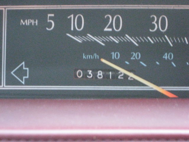 1989 Silver over Grey Metallic Cadillac DeVille 4 Door