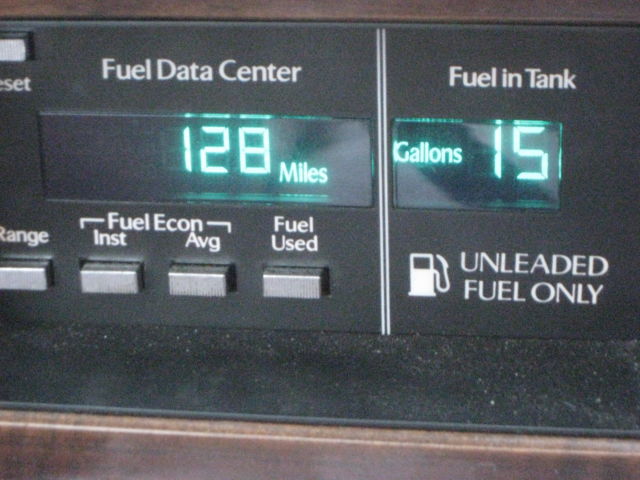 1989 Silver over Grey Metallic Cadillac DeVille 4 Door