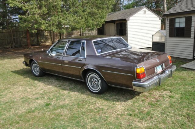 1984 brown Oldsmobile Eighty-Eight 4door ht