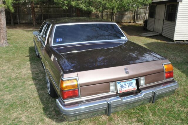 1984 brown Oldsmobile Eighty-Eight 4door ht