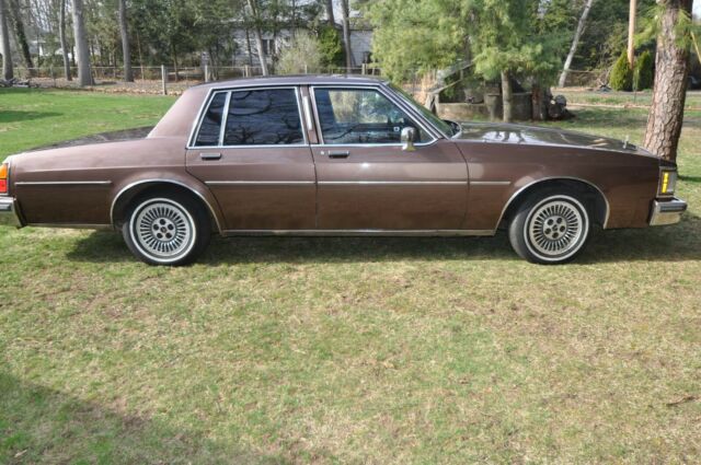 1984 brown Oldsmobile Eighty-Eight 4door ht