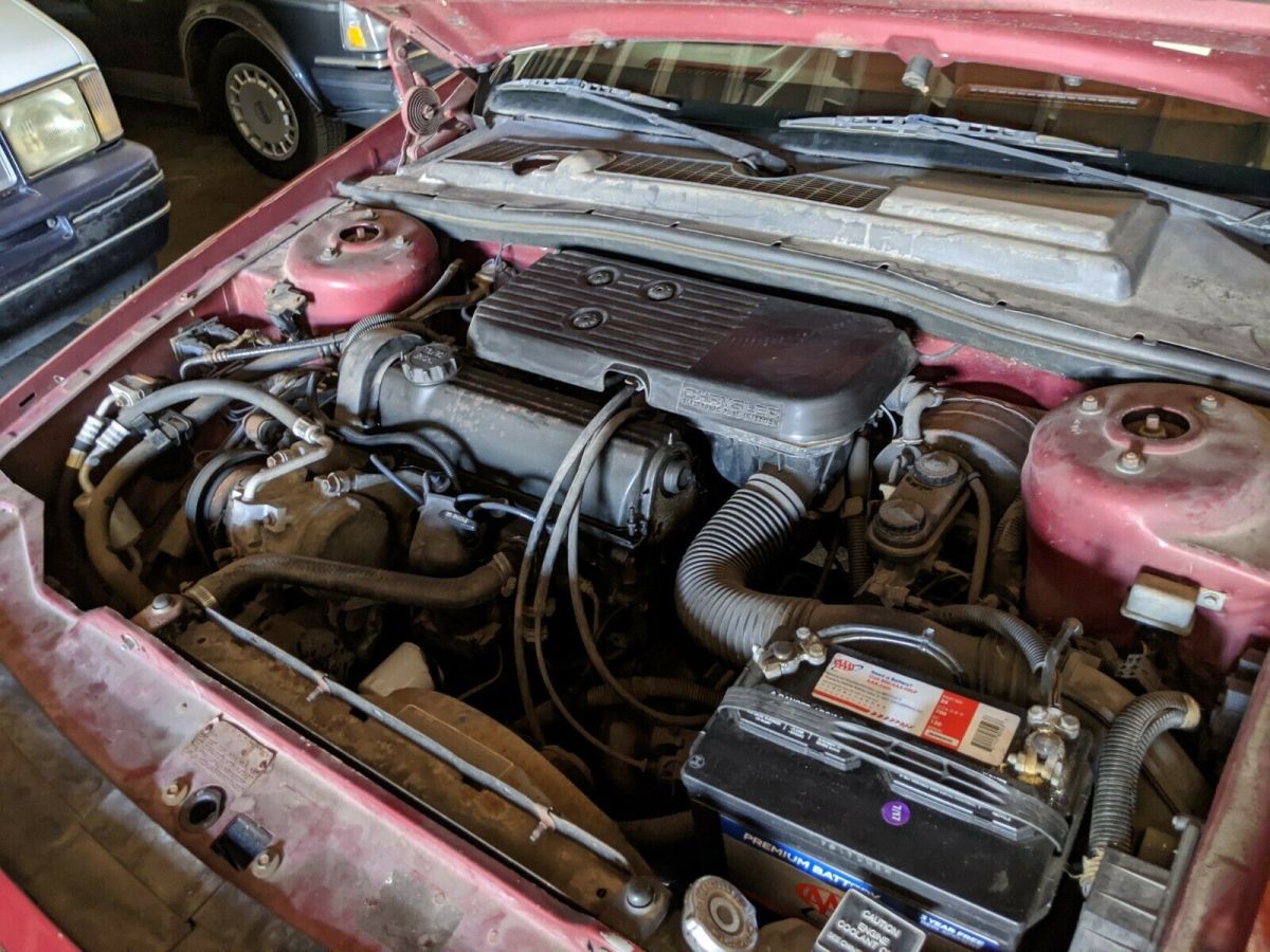 1989 Red Chrysler LeBaron Convertible