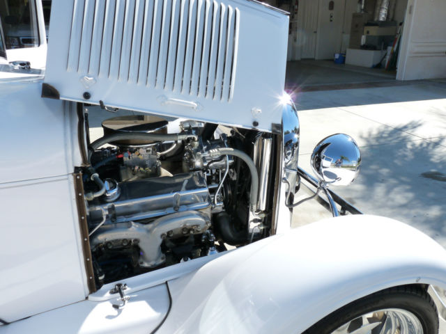 1928 White with pinstripe Ford Model A 2Door sedan