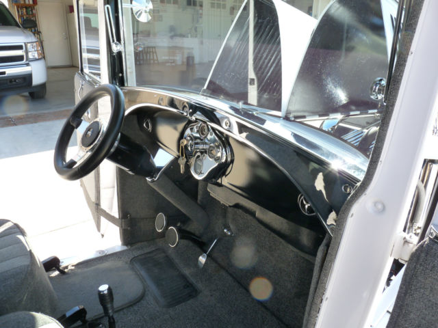1928 White with pinstripe Ford Model A 2Door sedan