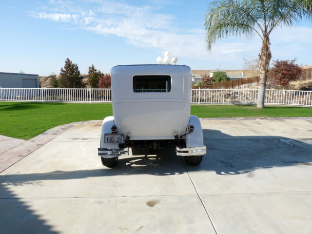 1928 White with pinstripe Ford Model A 2Door sedan