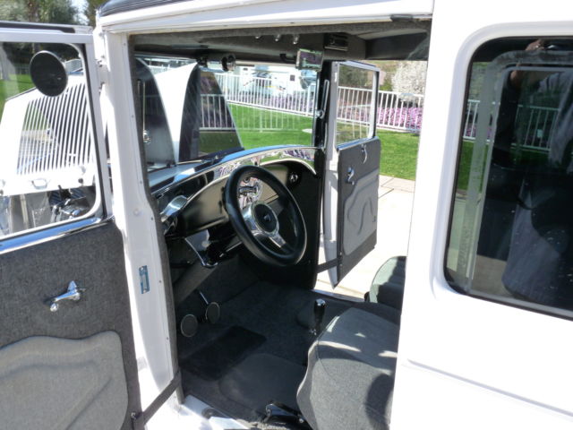 1928 White with pinstripe Ford Model A 2Door sedan