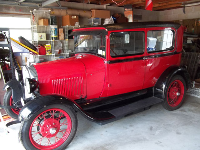 1928 red and black Ford Model A 2 door sedan