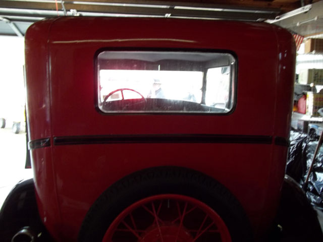 1928 red and black Ford Model A 2 door sedan