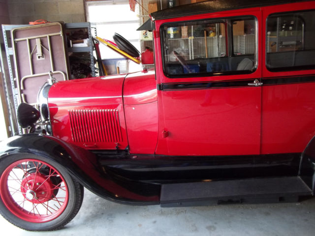 1928 red and black Ford Model A 2 door sedan