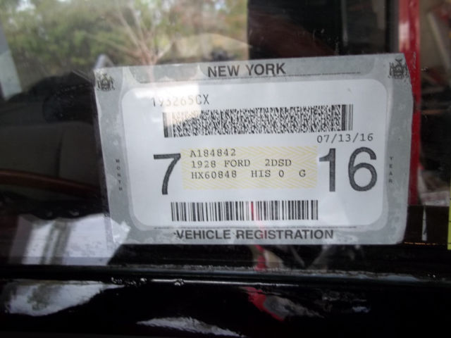 1928 red and black Ford Model A 2 door sedan