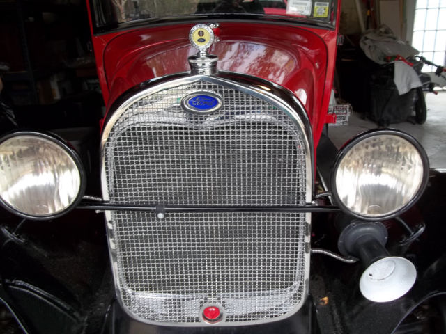 1928 red and black Ford Model A 2 door sedan