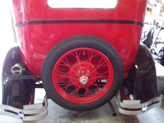 1928 red and black Ford Model A 2 door sedan