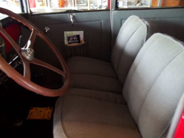 1928 red and black Ford Model A 2 door sedan