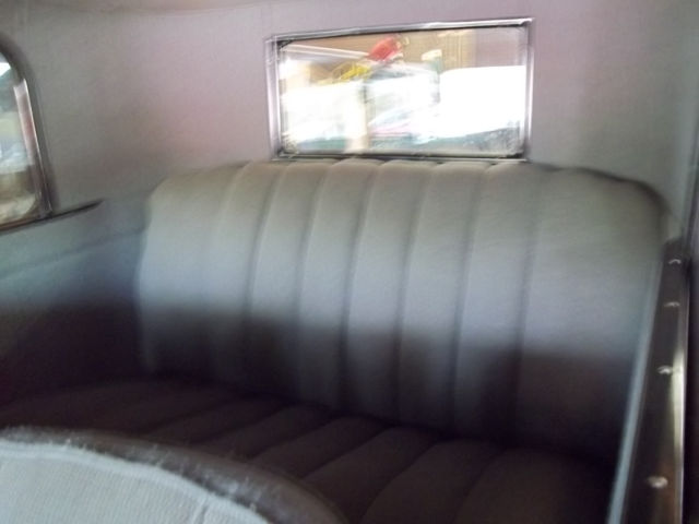 1928 red and black Ford Model A 2 door sedan