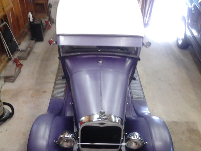 1928 purple Ford Model A two door sedan