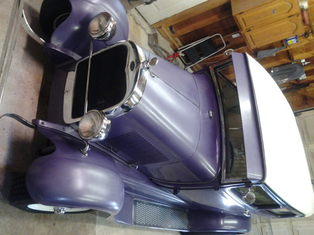 1928 purple Ford Model A two door sedan