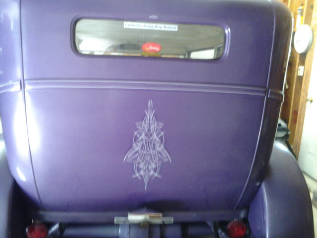 1928 purple Ford Model A two door sedan