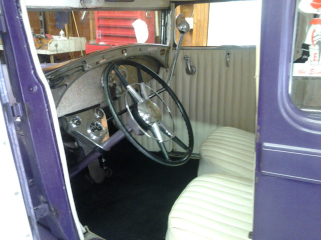 1928 purple Ford Model A two door sedan