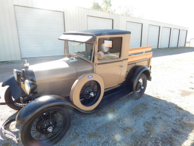 1928 brown and tan Ford Model A model a pickup