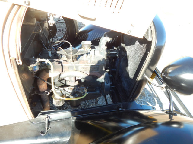 1928 brown and tan Ford Model A model a pickup