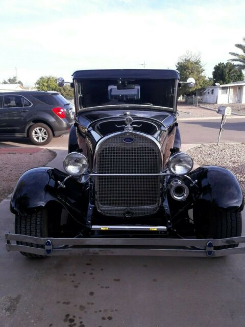 1929 Black Ford Model A 4 Door suicide doors