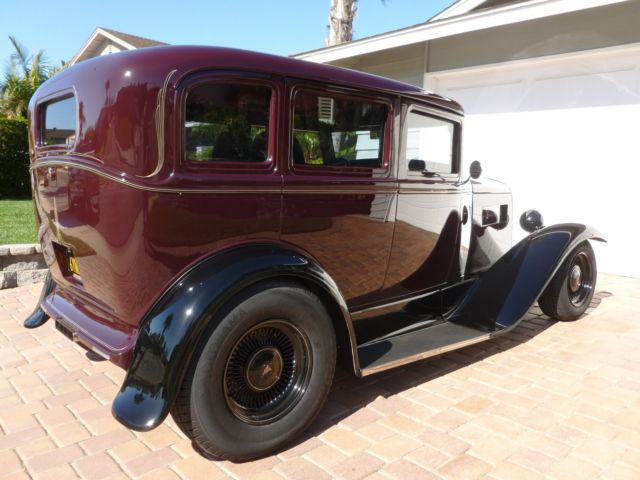 1930 maroon and black Ford Model A four door