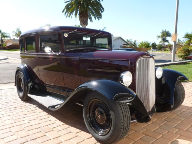 1930 maroon and black Ford Model A four door