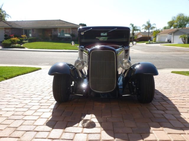 1930 maroon and black Ford Model A four door