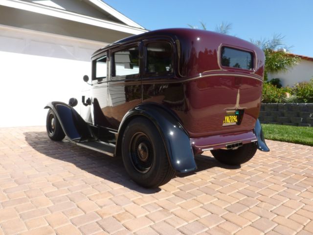 1930 maroon and black Ford Model A four door