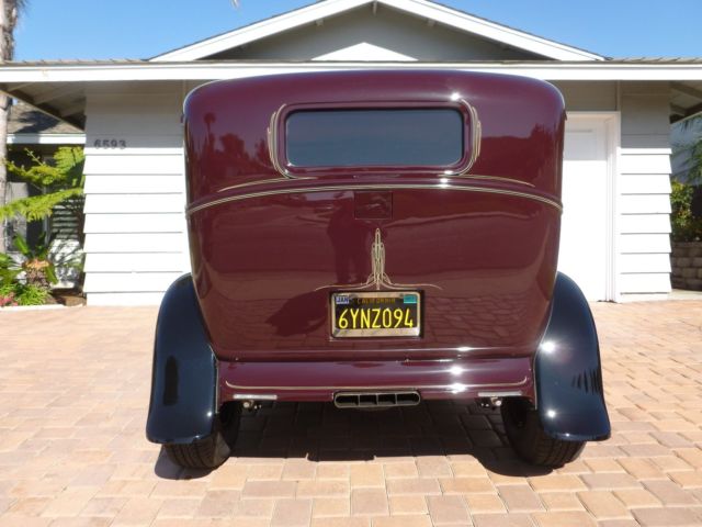 1930 maroon and black Ford Model A four door