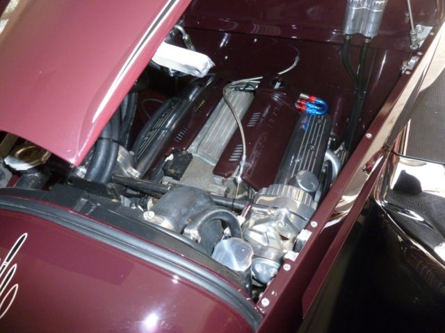 1930 maroon and black Ford Model A four door