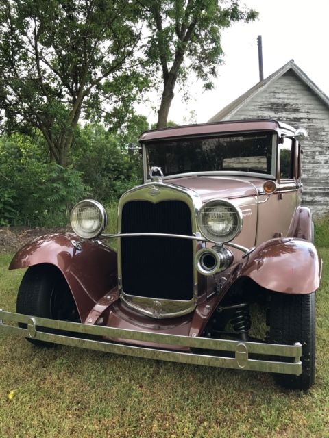 1930 brown metallic/tan metallic Ford Model A Sedan
