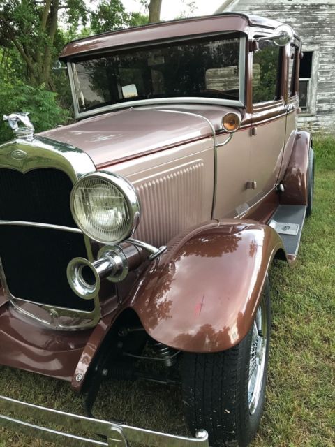 1930 brown metallic/tan metallic Ford Model A Sedan