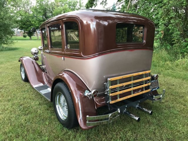 1930 brown metallic/tan metallic Ford Model A Sedan