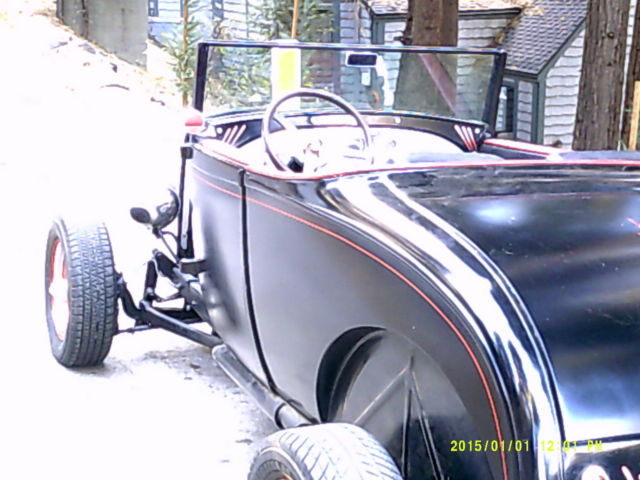 1930 flat black Ford Model A 2 door