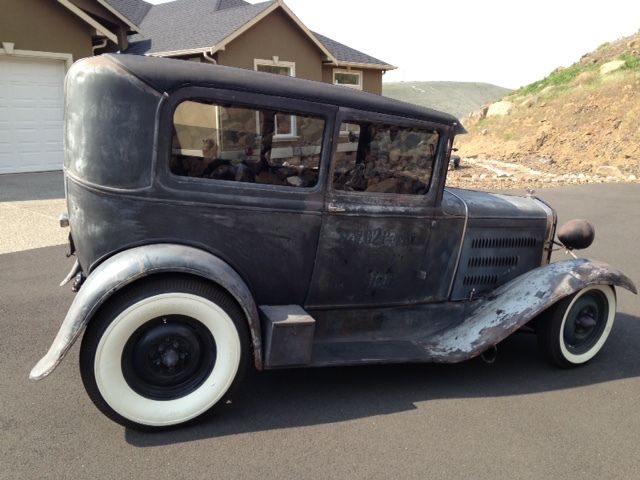 1931 Grey, black and rust Ford Model A Sedan