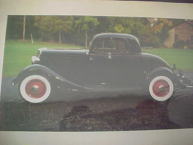 1934 maroon Ford three window coupe Coupe