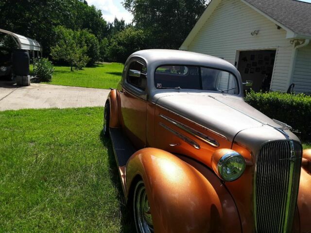 1936 Orange Chevrolet Master deluxe sport coupe Coupe