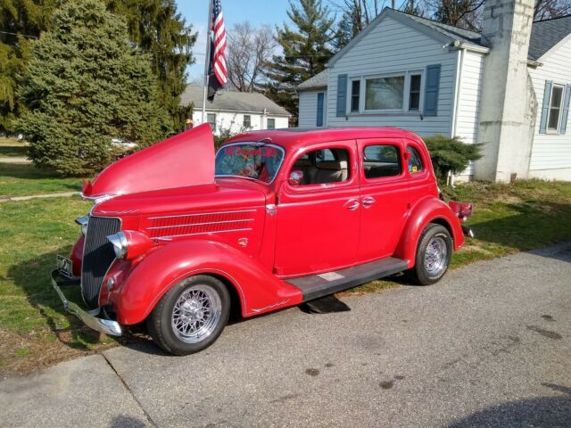 1936 Red Ford V 8 4 door sedan