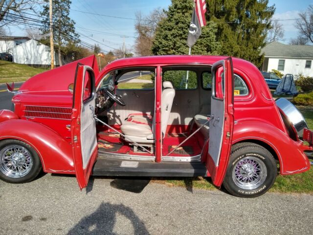 1936 Red Ford V 8 4 door sedan