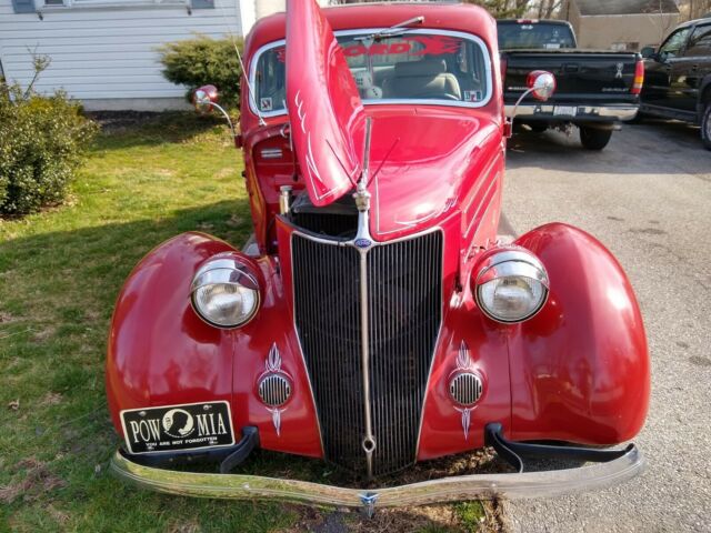 1936 Red Ford V 8 4 door sedan