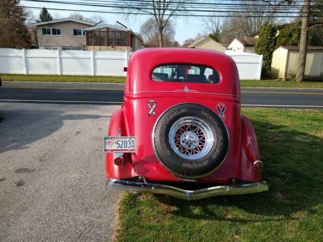 1936 Red Ford V 8 4 door sedan