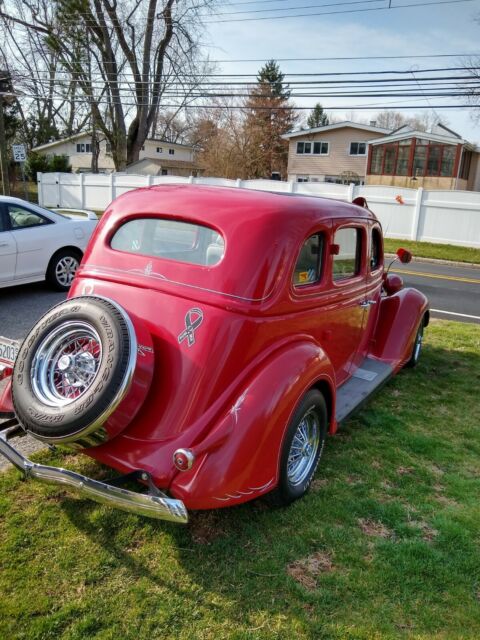 1936 Red Ford V 8 4 door sedan