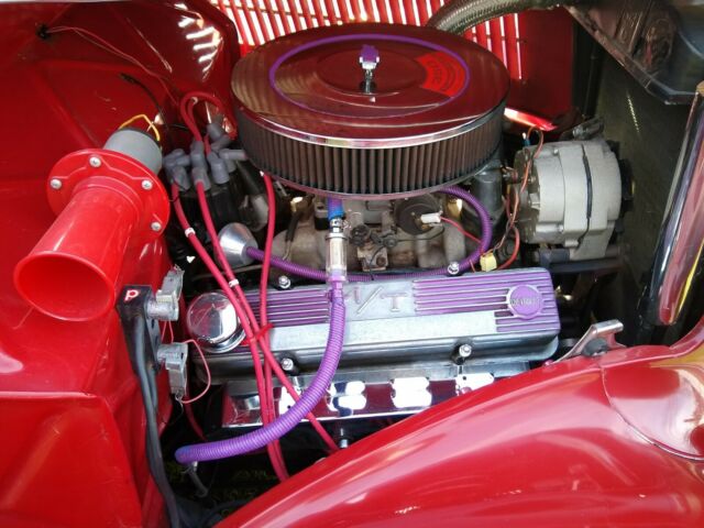 1936 Red Ford V 8 4 door sedan