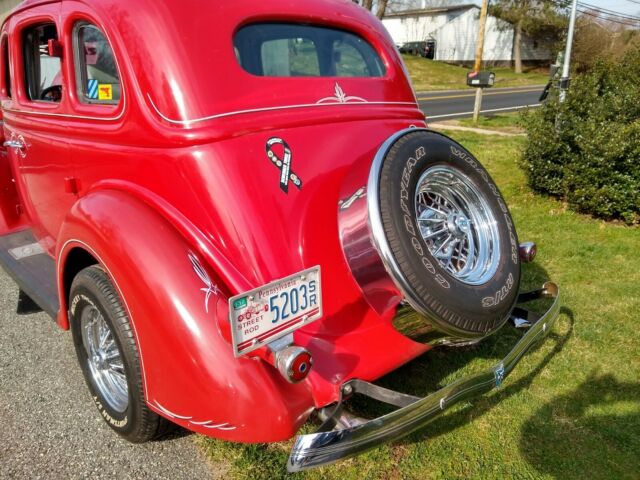 1936 Red Ford V 8 4 door sedan