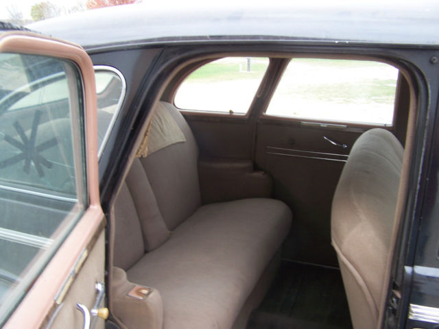 1940 black Buick Century 4 door suicide style