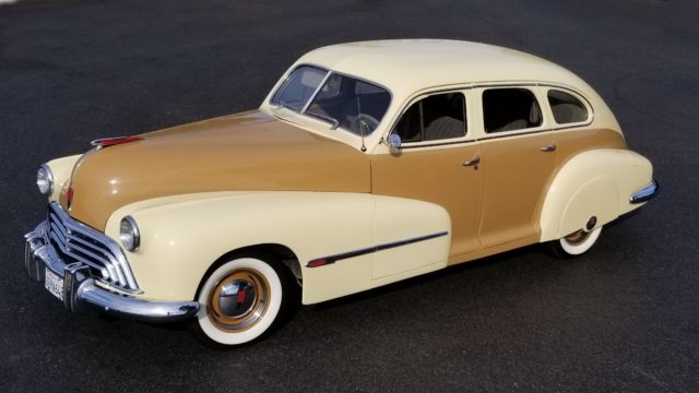 1946 Yellow Oldsmobile Custom Cruiser Sedan